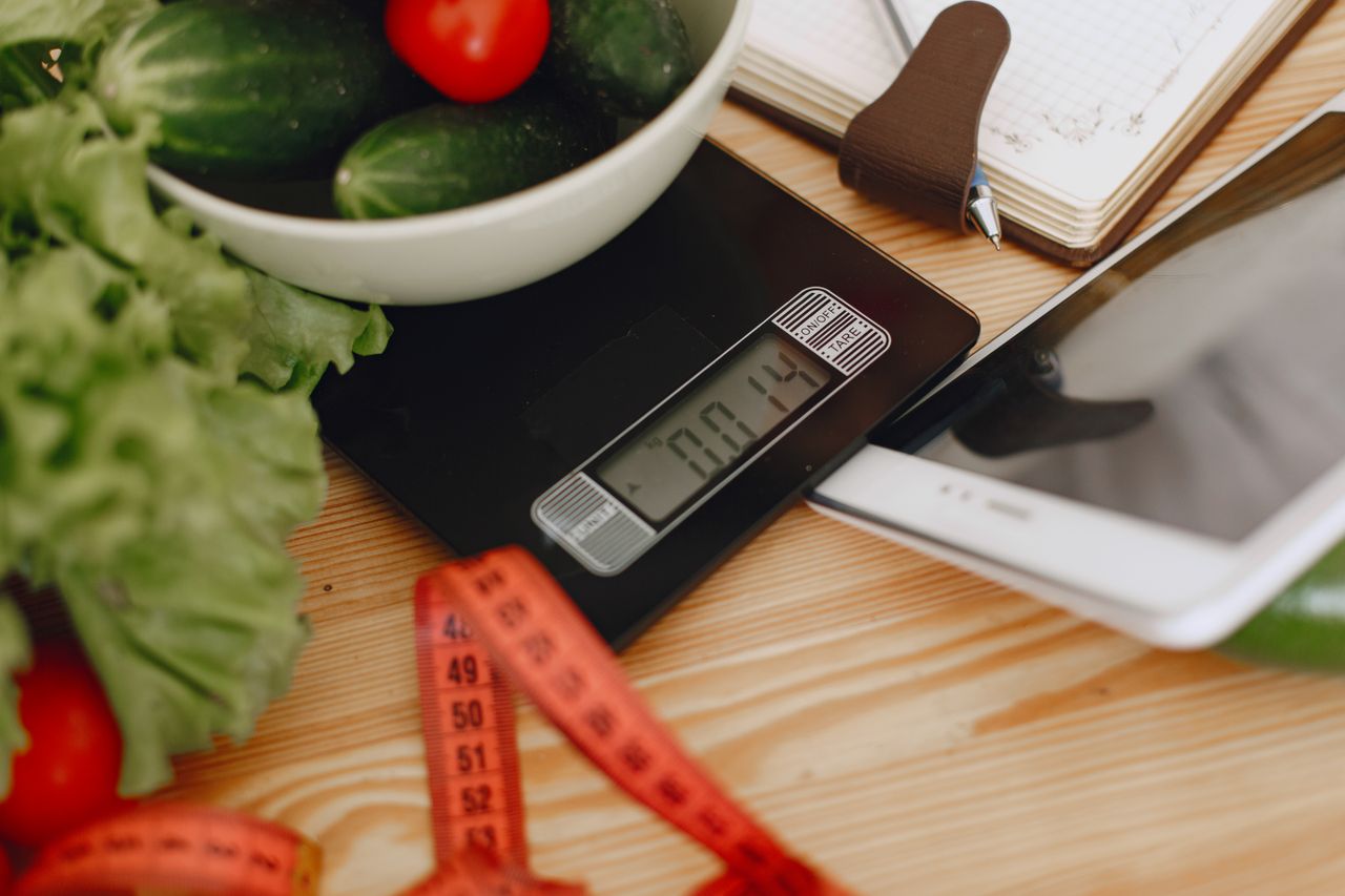 Crafting Captivating Headlines: Your awesome post title goes here A bowl of fresh vegetables on a kitchen scale with measurement tools, depicting a healthy lifestyle.